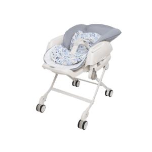 Combi Dreamy (Manual Swing) parenting station, reclined with its floral cushion.