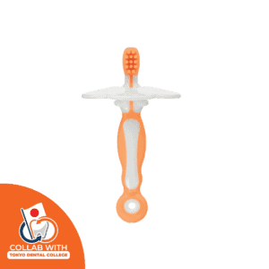 Orange Combi Teteo Step 1 training toothbrush with a soft brush head and detachable shield, collab with tokyo dental collage icon appear in lower left corner of the image