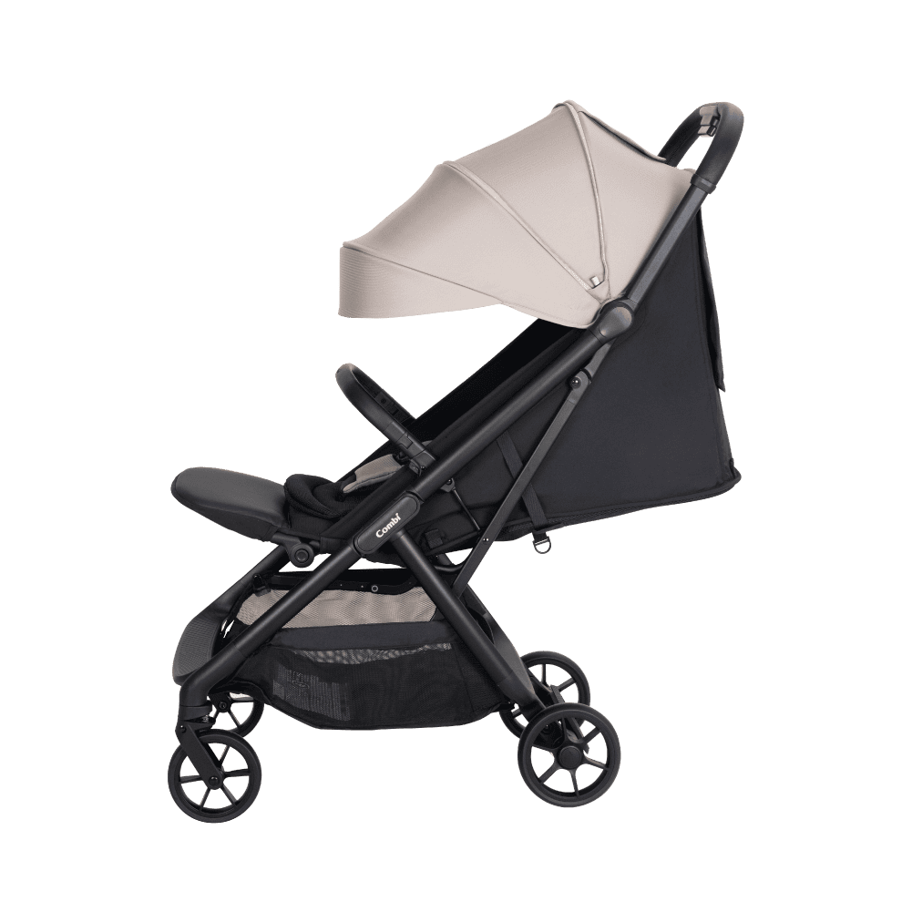 Combi Auto N Neo stroller in beige, with the canopy extended.