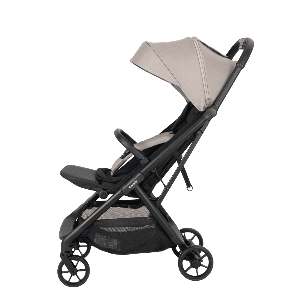 Combi Auto N Neo stroller in beige, with the canopy retracted.