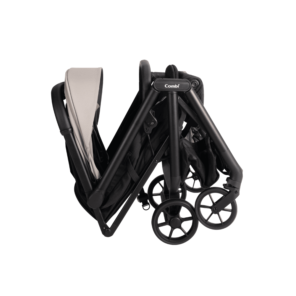 Combi Auto N Neo stroller in beige, shown partway through folding.