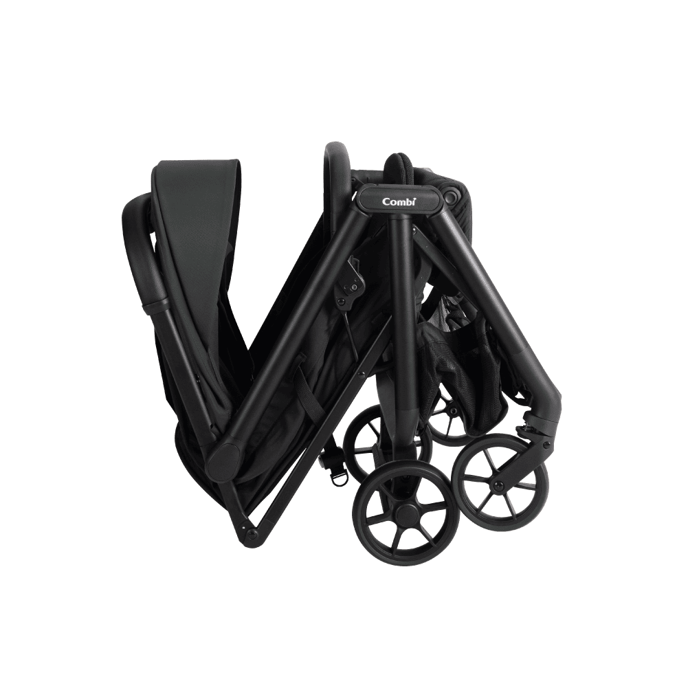 Combi Auto N neo stroller in dark green, shown partway through folding.