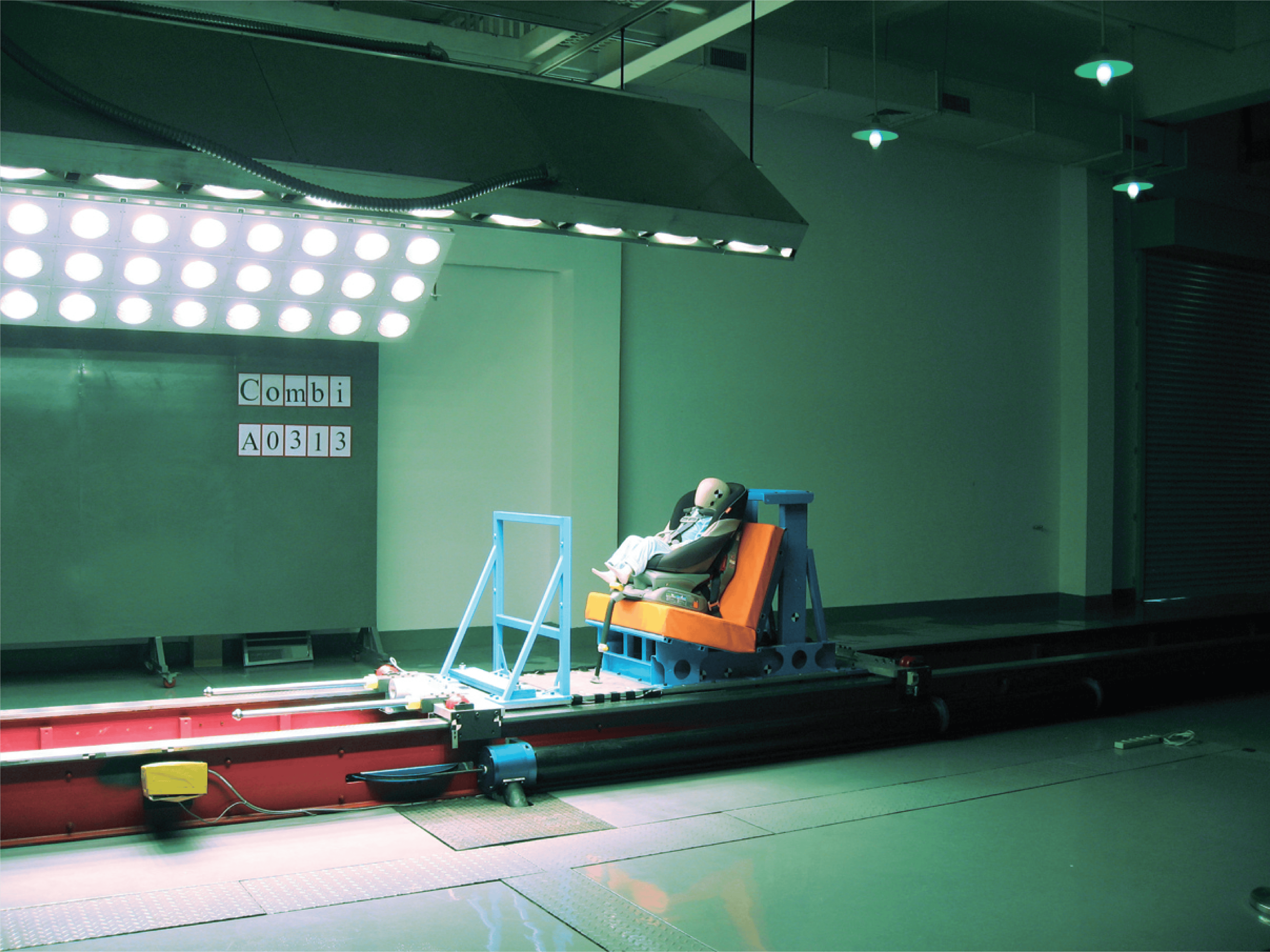 A child car seat mounted on a laboratory test rig.